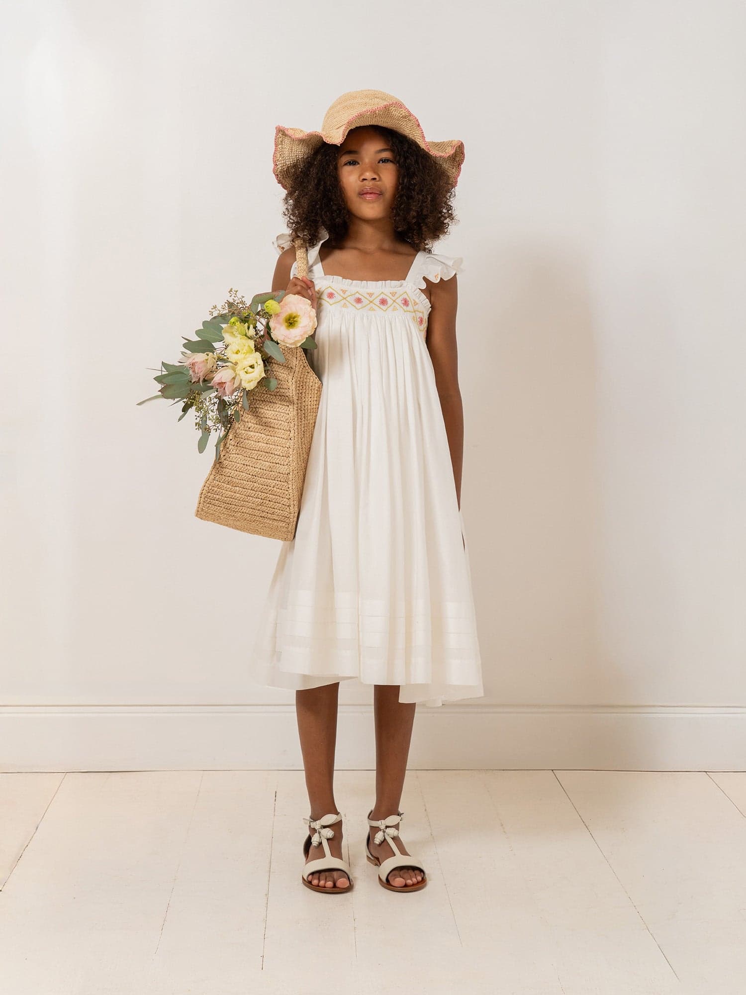 Laora dress smocked and hand-embroidered in organic cotton