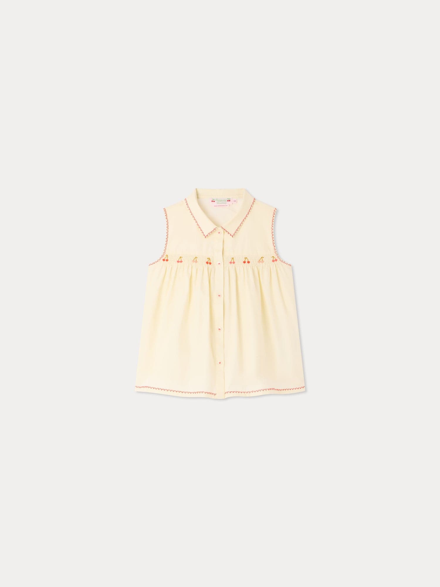 Lexi smocked and hand-embroidered blouse in organic cotton