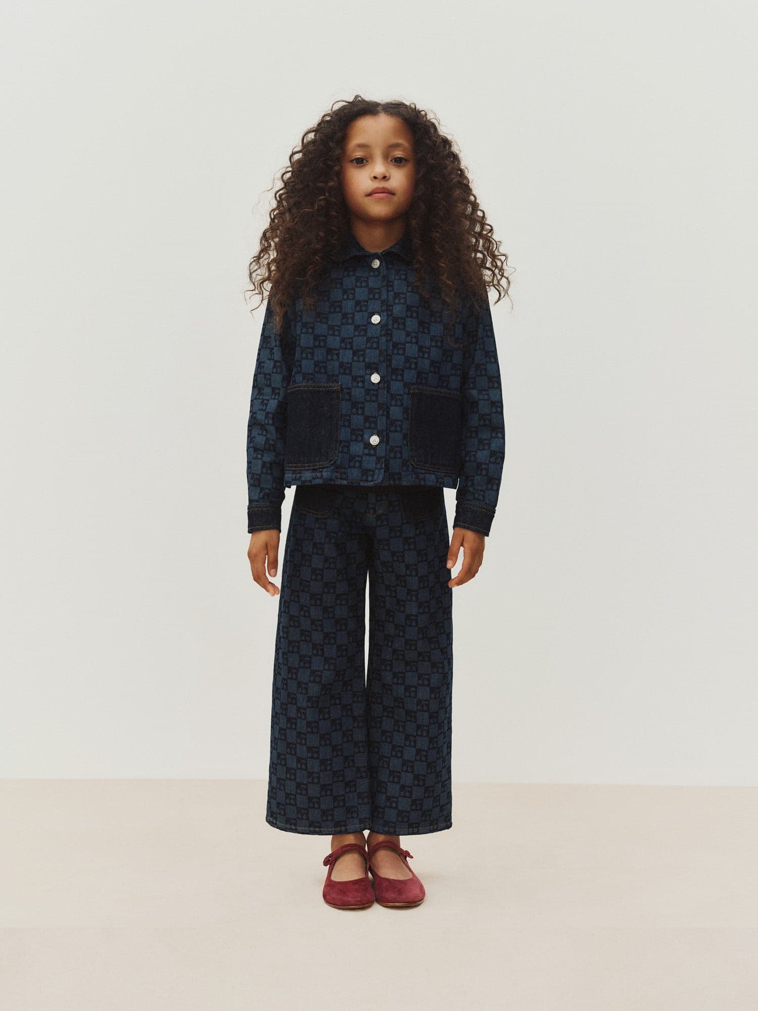 Minalie cherry checkerboard-print denim trousers in organic cotton